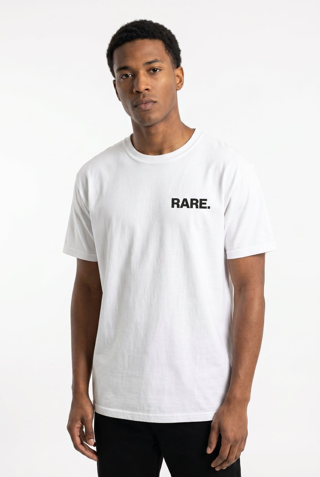 Person wearing a white t-shirt with 'RARE.' text on a white background